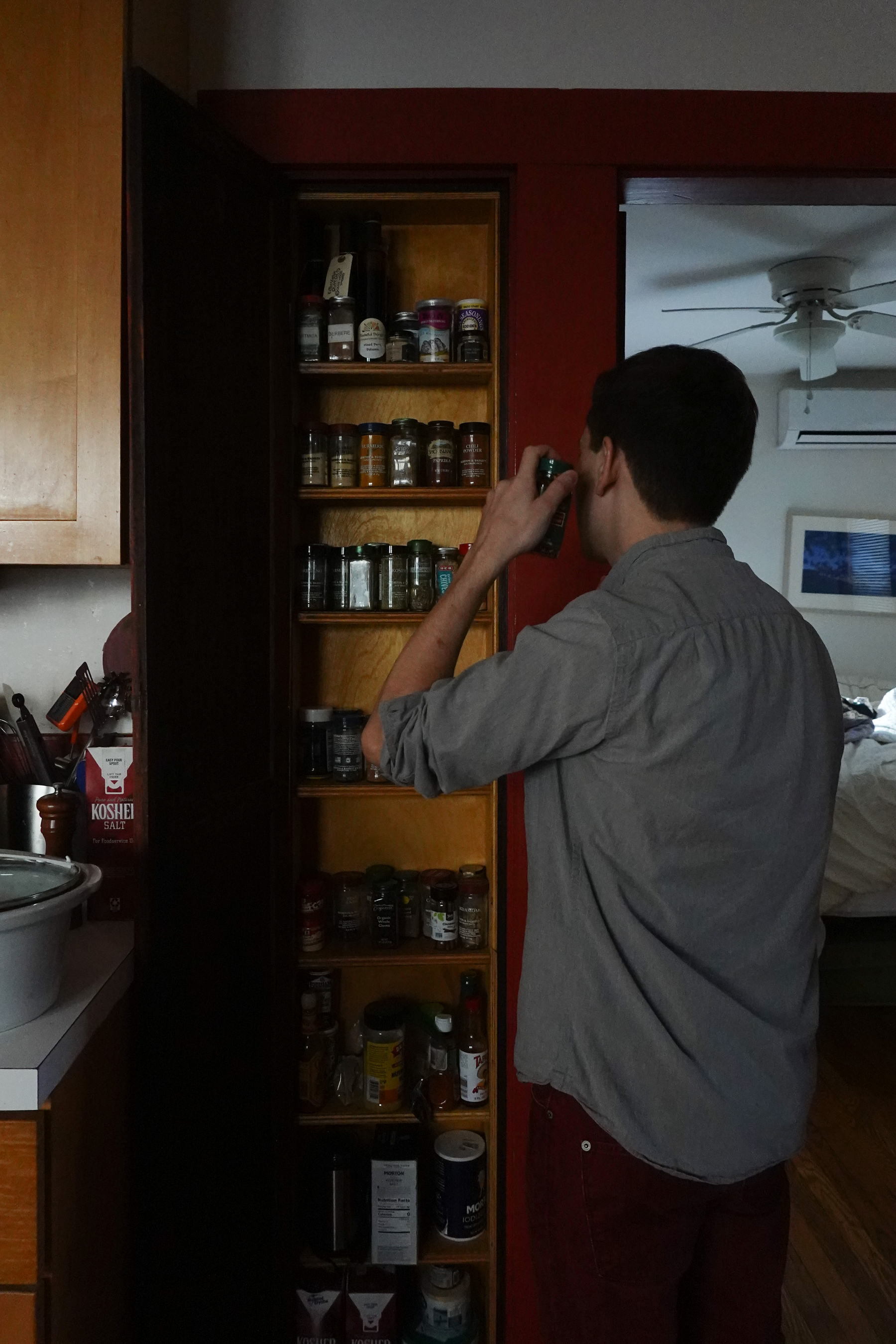 I'm standing next to my spice rack shaking a spice container to hear what it is 