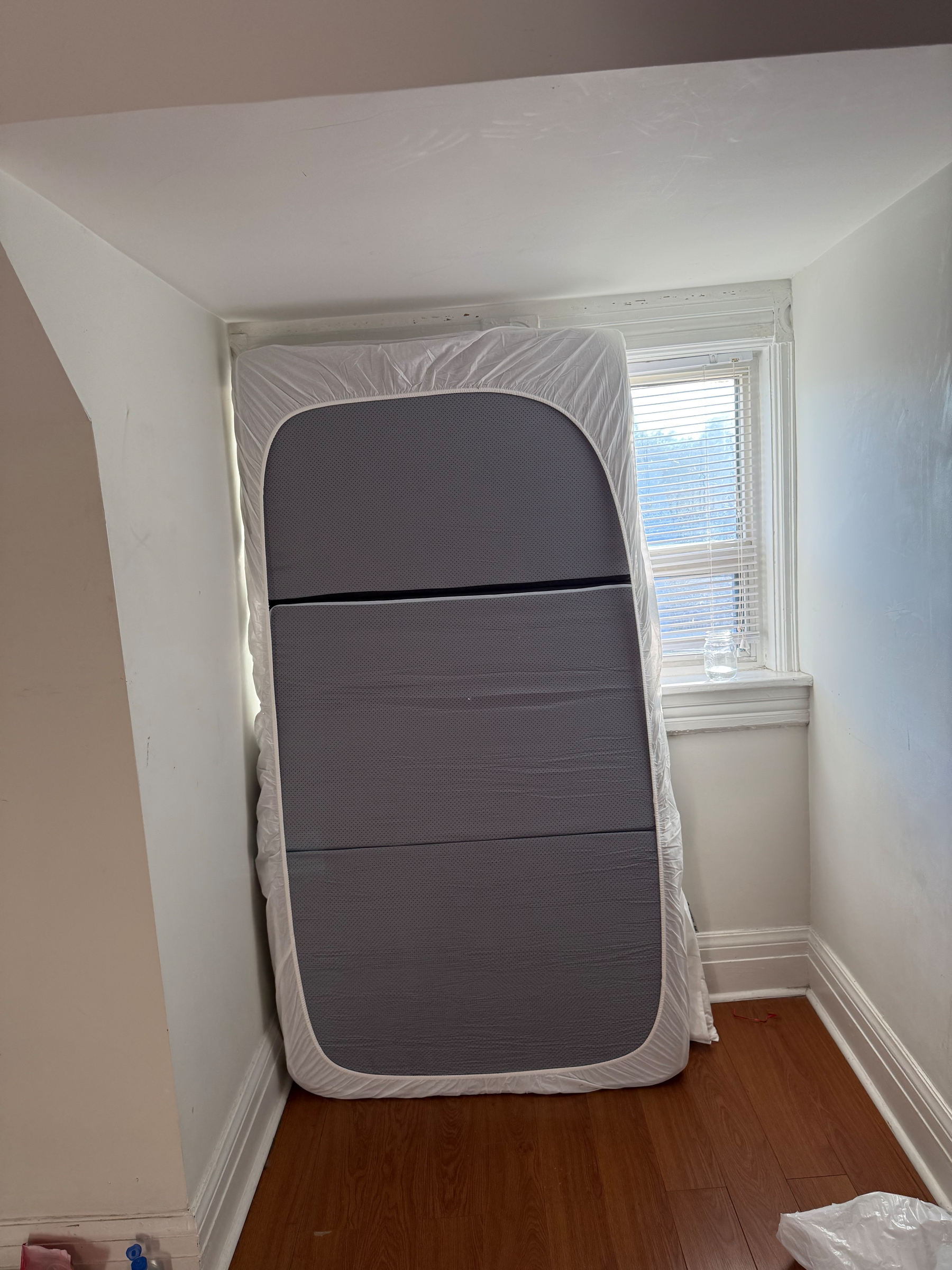 This is the room I am staying in and there is a mattress that I've propped up against the window. It is blocking the light. It is not a conventional sketch, but I called it a sketch because it is like sketching out ideas IRL with real-world stuff. Anyways, it is an idea for a murphy bed that can be folded up to block light once the sun wakes you up and you need to stop the glare. But it is also just a floor mattress propped up against a window so there is something funny and trashy about it. OK, this alt text got way too long. PEACE. 