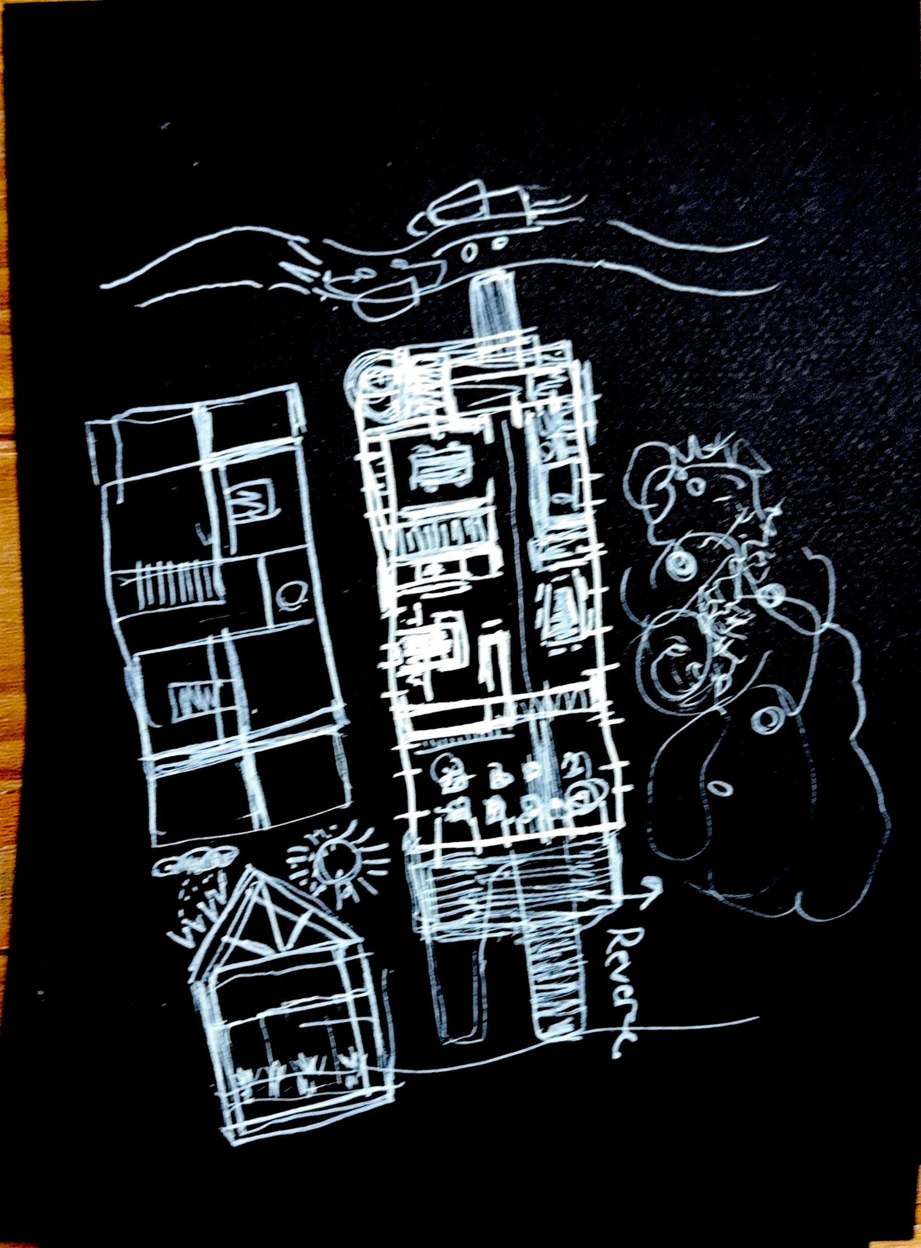 A white hand-drawn architectural floor plan is sketched on a black surface. It's subdivided into two artist studios and includes a top and bottom floor with some trees on the riht side of the house. It's also showing a quick sketch of the section and you can see a trus system.